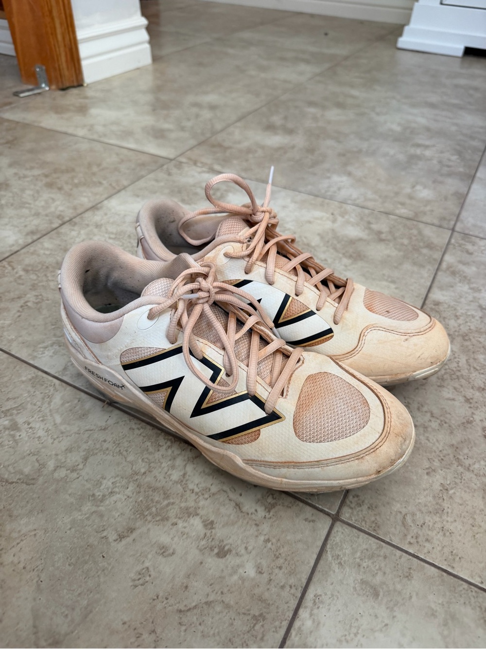 Women’s size 10 New Balance Metal Cleats